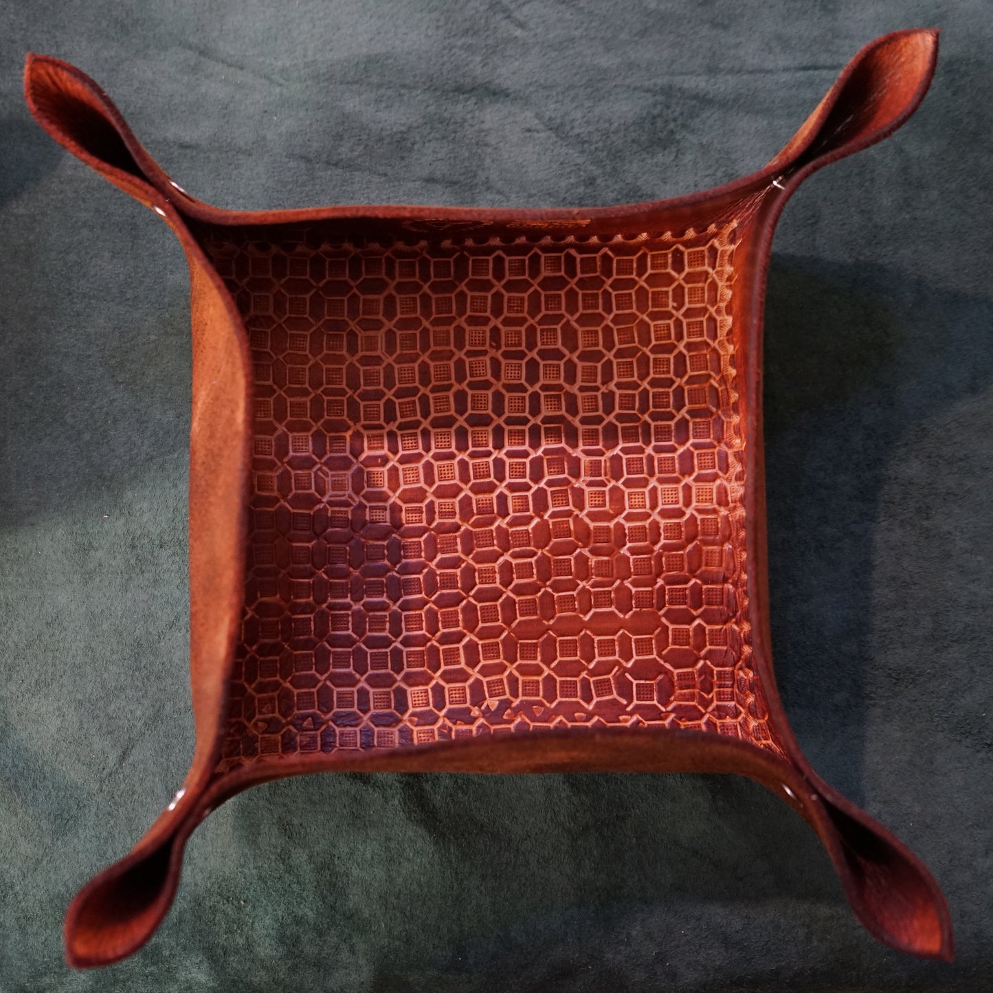 Red woven basket on a dark gray surface